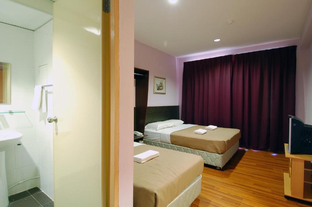 Aristo Hotel Putatan Kota Kinabalu Rum bild